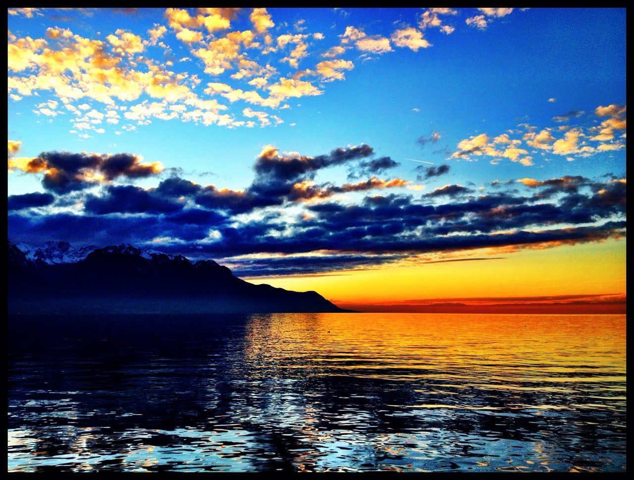 transfer print, water, sunset, sky, scenics, tranquil scene, beauty in nature, tranquility, auto post production filter, sea, waterfront, nature, cloud, idyllic, cloud - sky, rippled, reflection, mountain, lake, orange color