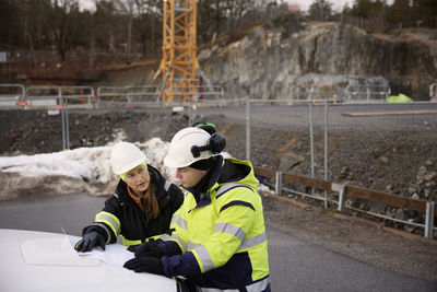 Engineers talking at building site