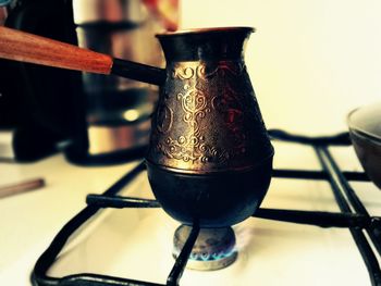 Close-up of pitcher on stove burner