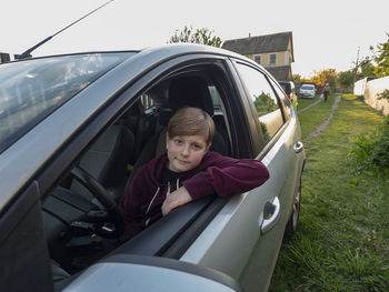 Portrait of smiling girl in car