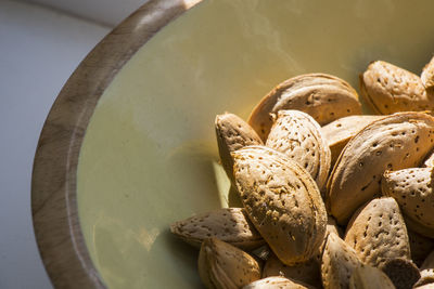 Almond close-up, almond with shell in bowl