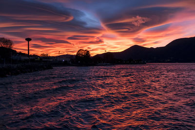 Spiral clouds at sunset over the lake maggiore