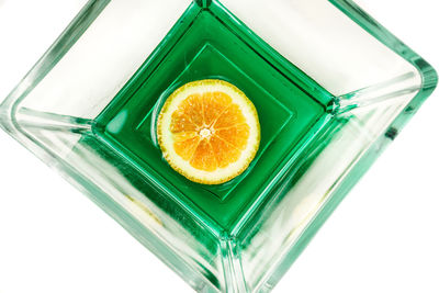 Close-up of orange fruit against white background