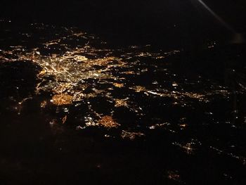 Low angle view of illuminated sky at night