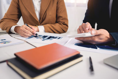 High angle view of business people working on table