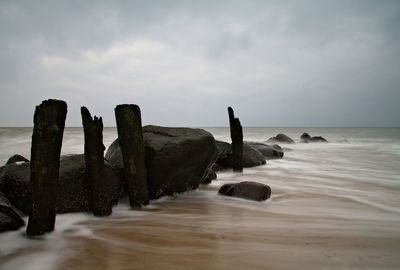 Scenic view of sea against cloudy sky