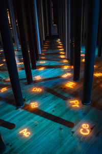 Illuminated lights on footpath at night