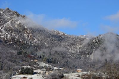 Scenic view of mountains against sky during winter