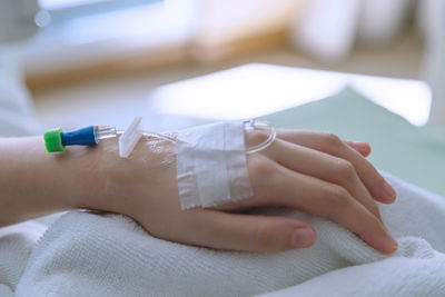 Close-up of hand holding eyeglasses