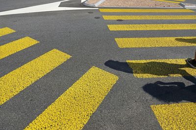 High angle view of yellow markings on road