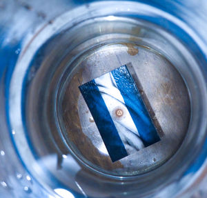 Close-up of blue glass in container