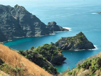 High angle view of sea by cliff