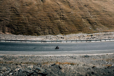 High angle view of road by field