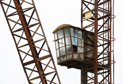 Low angle view of crane against clear sky