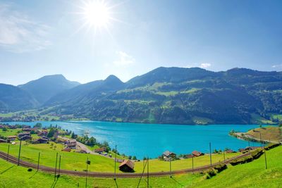 Scenic view of landscape against sky on sunny day