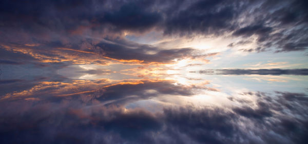 Low angle view of clouds in sky during sunset