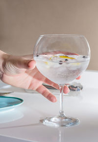 Close-up of hand holding wineglass
