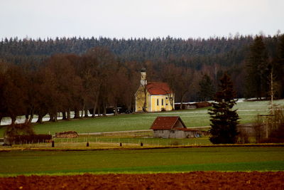 Built structure on landscape against sky