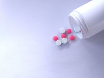 High angle view of bottle on table against white background