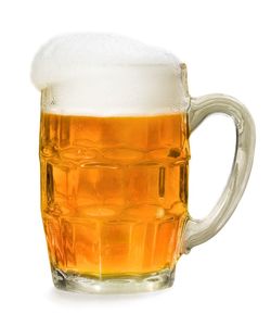 Close-up of beer glass against white background