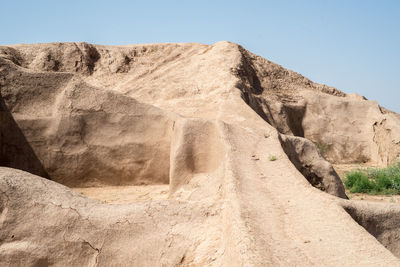 Low angle view of rock formations against sky