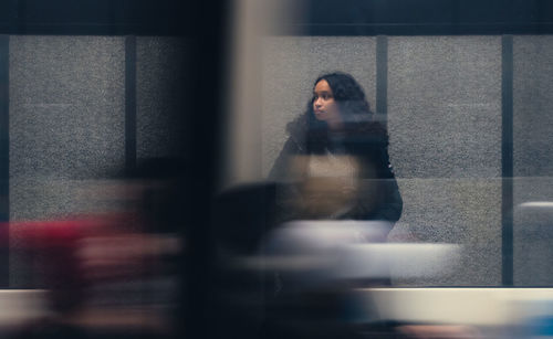 Rear view of woman walking on street