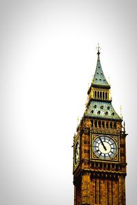 Low angle view of clock tower against clear sky
