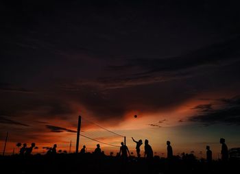 Silhouette people at sunset