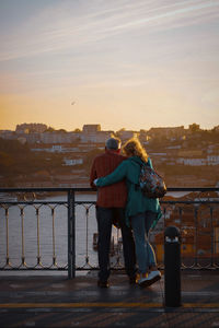 Rear view of people looking at cityscape