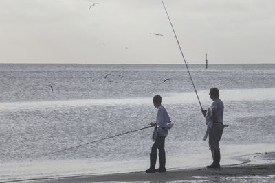 Men fishing at sea