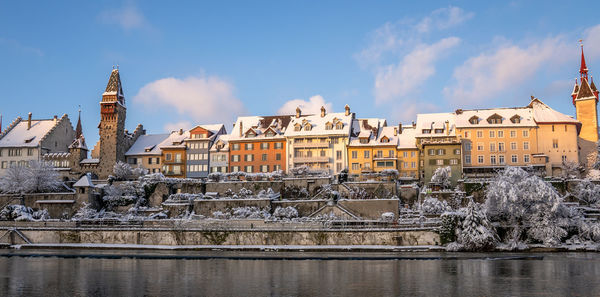 Buildings against cloudy sky