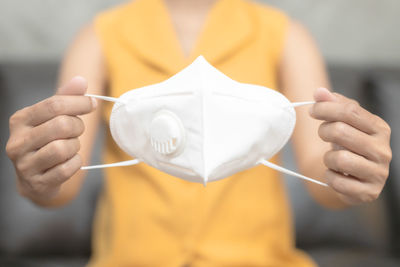 Close-up of man holding paper