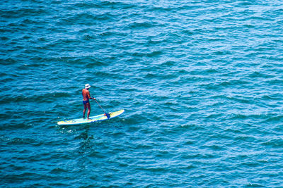 High angle view of man kayaking in sea