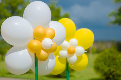 Close-up of helium balloons outdoors