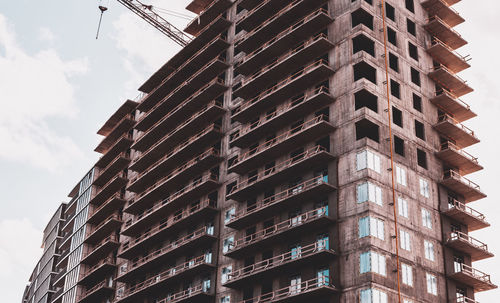 Close-up. skyscraper and building crane at a construction site.