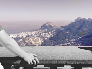 Cropped image of woman standing on mountain against sky