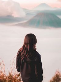 Rear view of woman looking at mt bromo