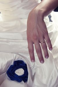 Midsection of bride wearing ring during wedding celebration