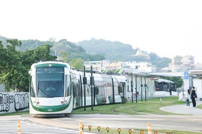 View of cars on road against clear sky