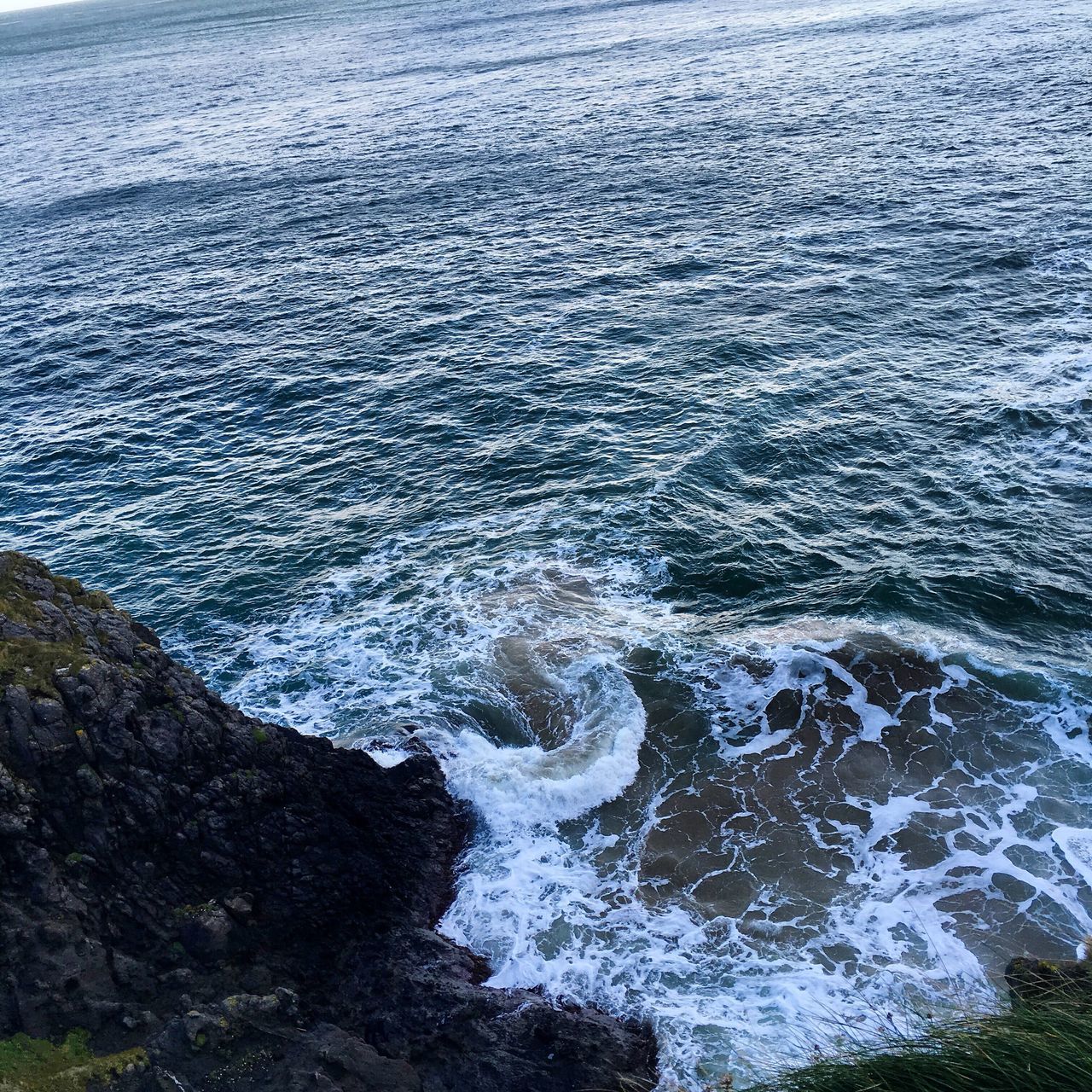 water, sea, rippled, beauty in nature, tranquility, nature, high angle view, scenics, tranquil scene, waterfront, wave, day, outdoors, no people, surf, idyllic, blue, backgrounds, full frame, non-urban scene