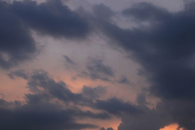 Low angle view of dramatic sky during sunset