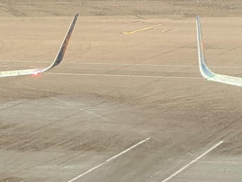 High angle view of airplane on airport runway