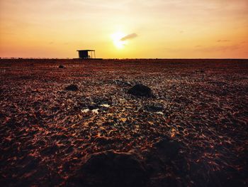 Scenic view of field against sky during sunset