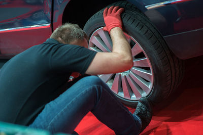 Mechanic repairing car at garage