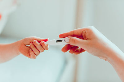 Close-up of woman holding hands