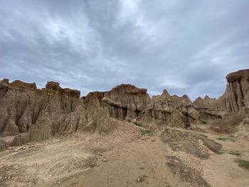 Panoramic view of rock formations against sky