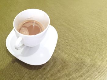 High angle view of coffee cup on table