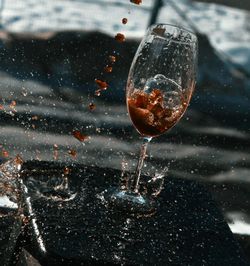High angle view of drink splashing on table