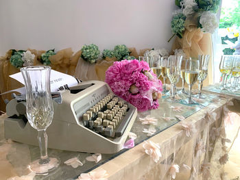 Close-up of flowers in glass on table