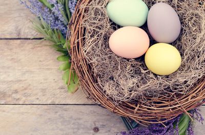 Directly above shot of colorful easter eggs in nest